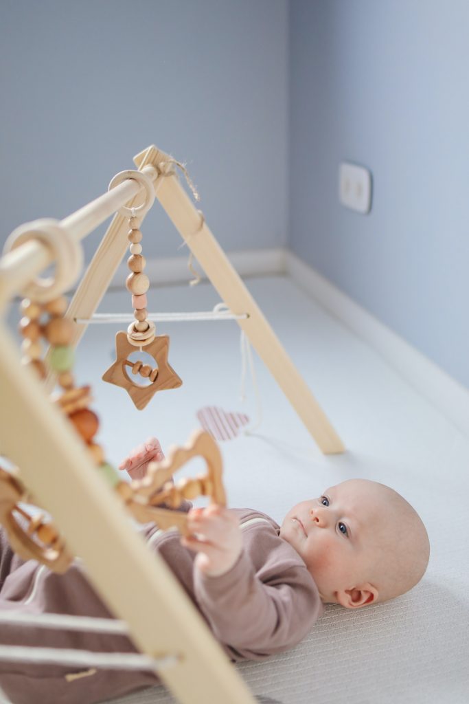 Stages of Play Development: Unoccupied Play Example: Baby looking up at mobile